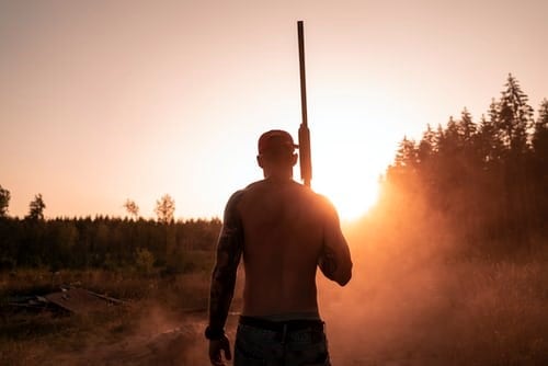 sunset man shotgun