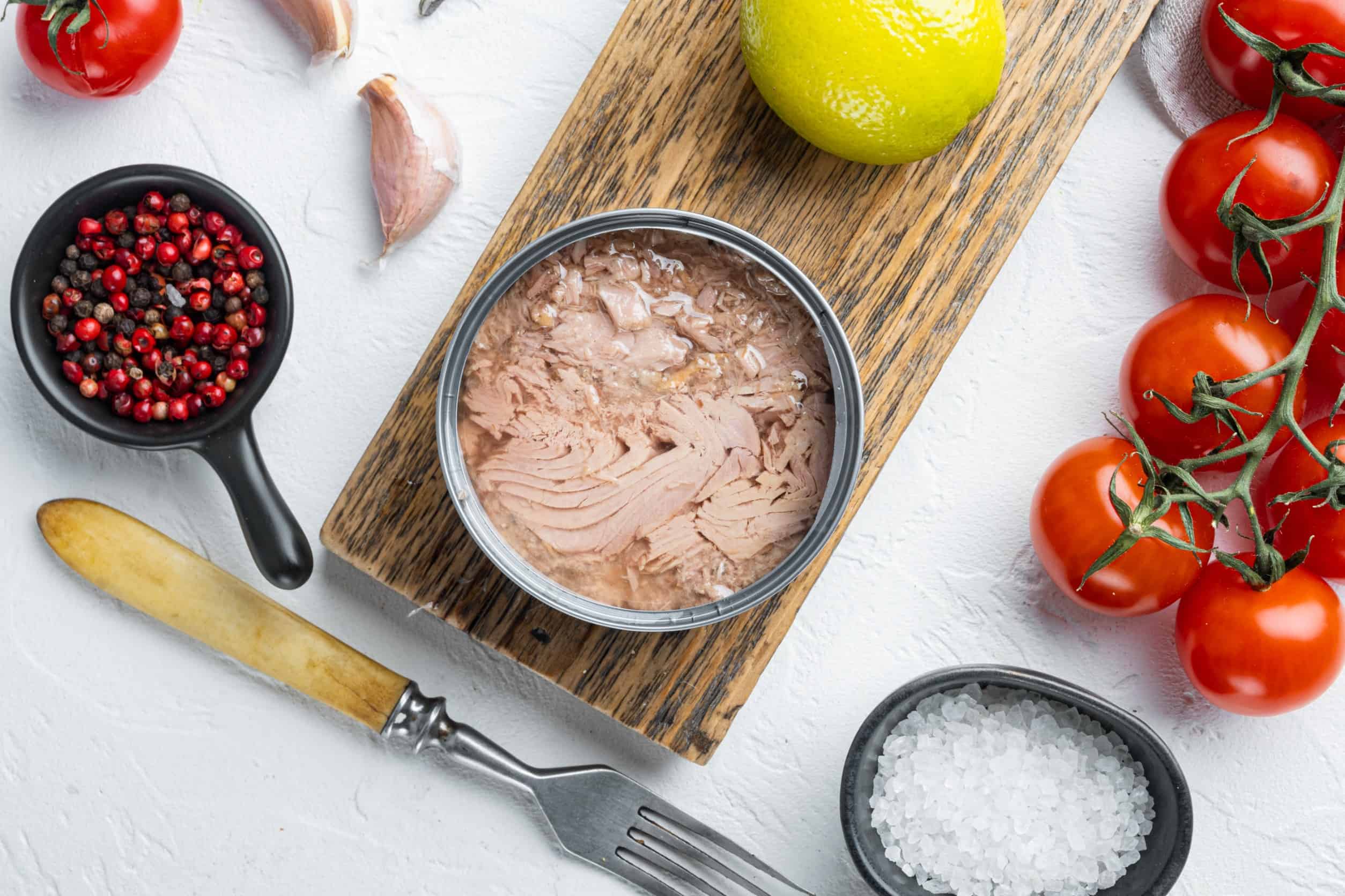 tuna in a can with tomatoes and herbs