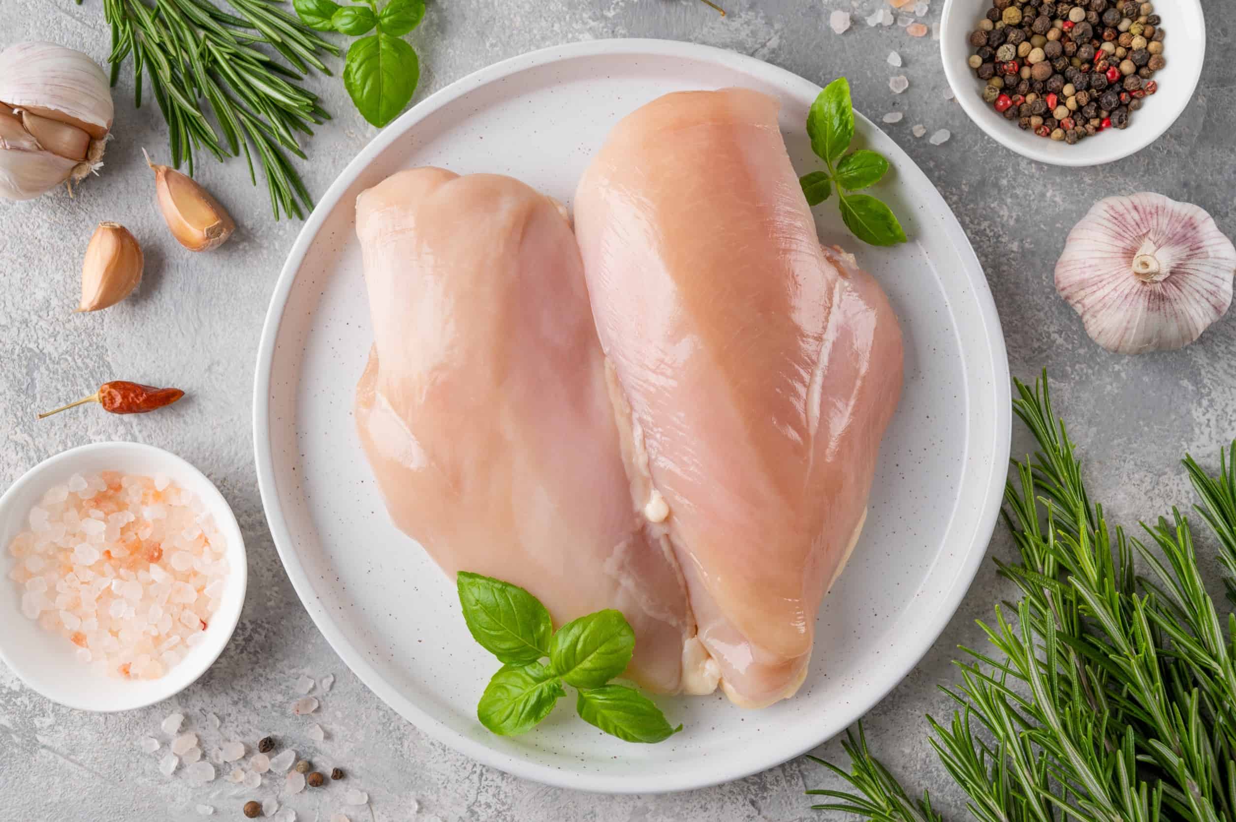 raw chicken with herbs